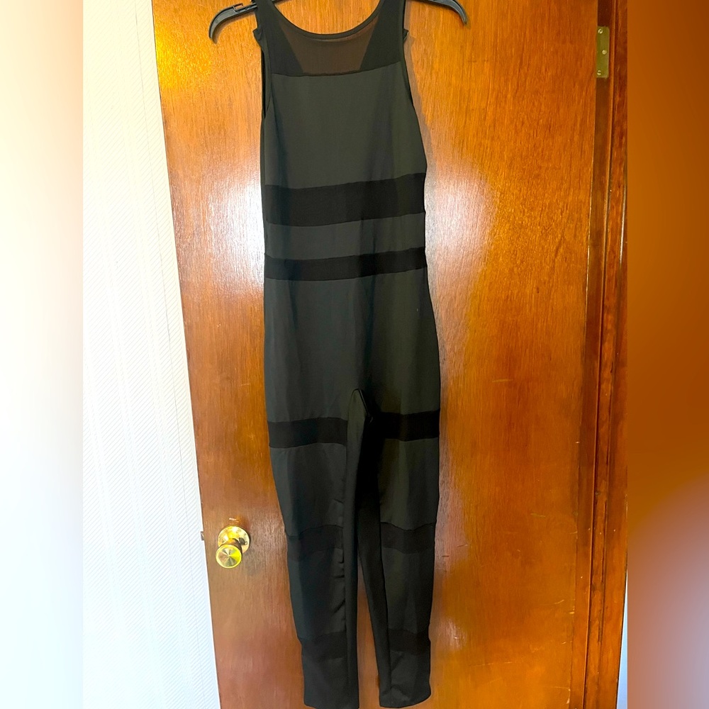 Women's one piece athletic wear pant romper, black worn size medium